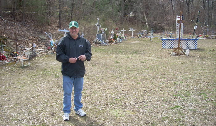 A drummer inspecting the memorial at the Station Nightclub site where one hundred people burned to death