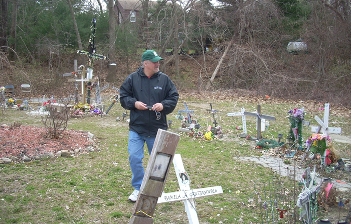 Leo is walking in the memorial to the one hundred who burned to death